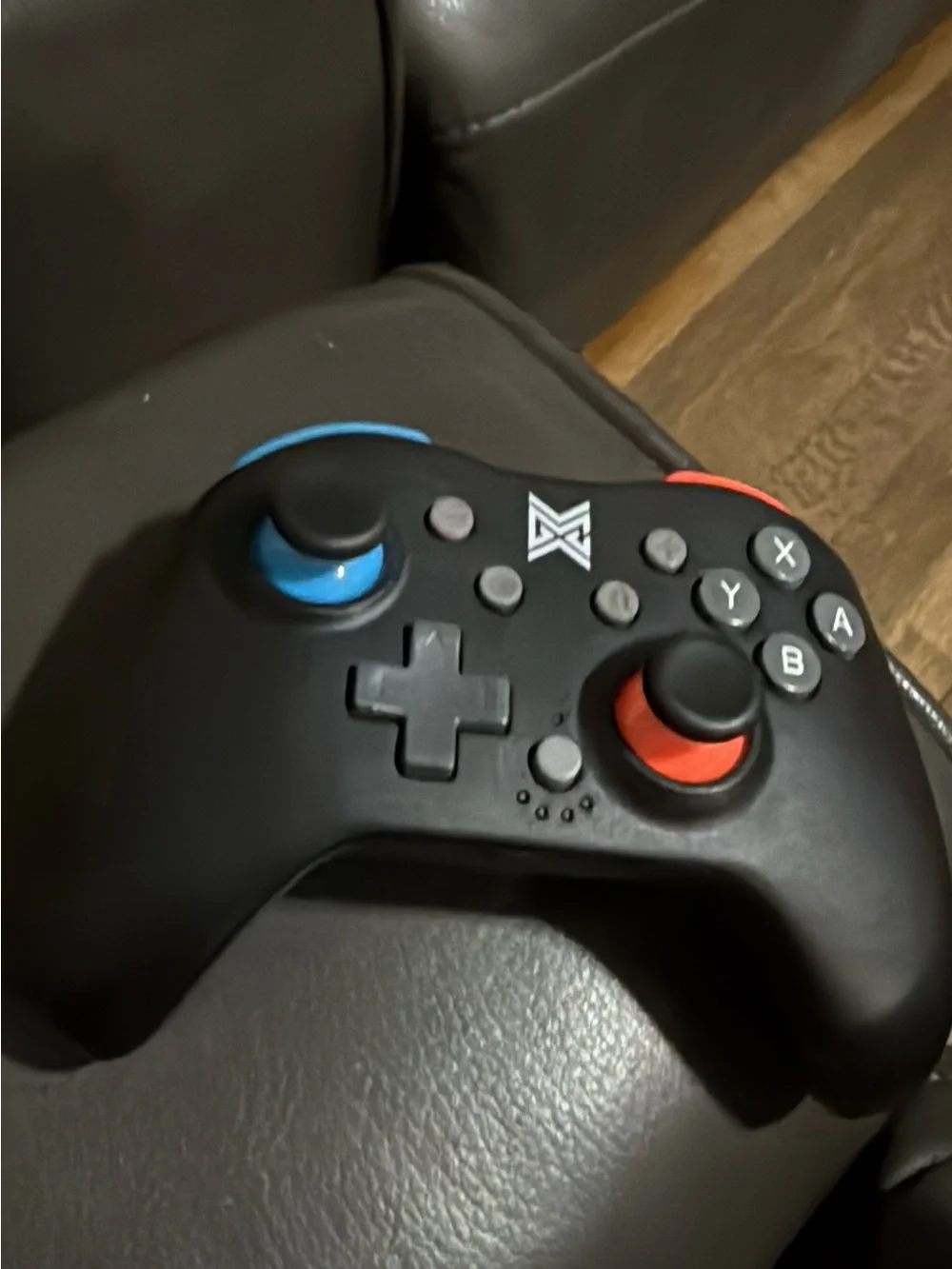 Brand new Black Wireless Game Controller with Blue & Orange Accents